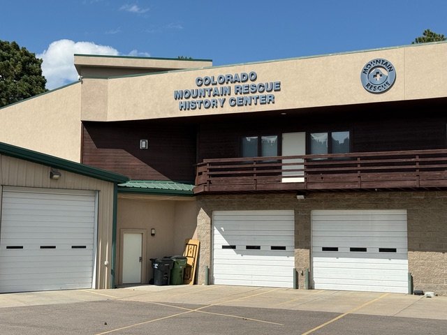 Building sign reading Colorado Mountain Rescue History Center